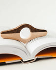 Thumb book page holder