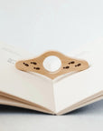 Thumb book page holder