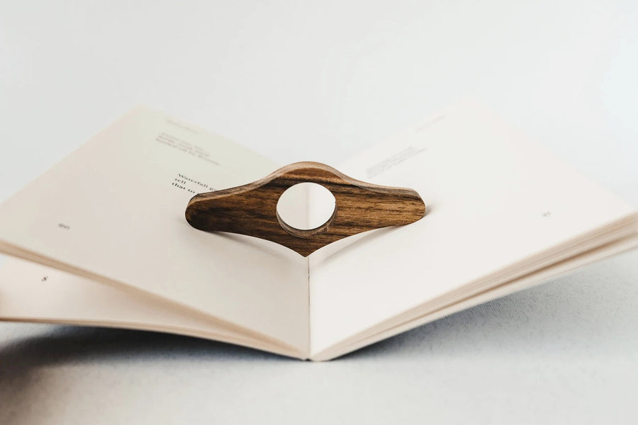 Thumb book page holder